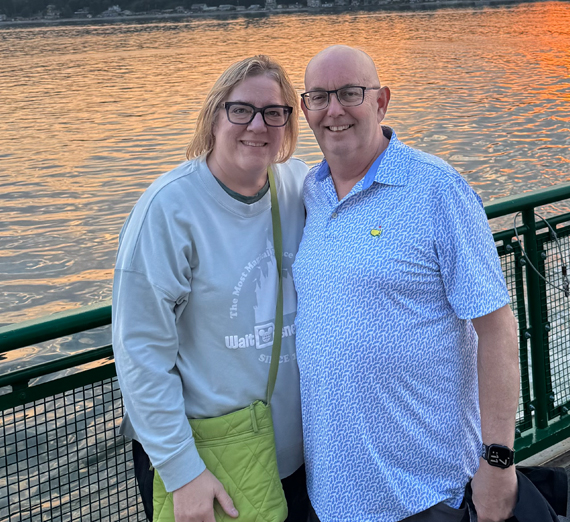 Artist Ben Joyce paints on a canvas